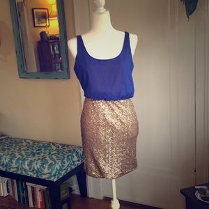Blue and gold open back blouson wiggle dress.